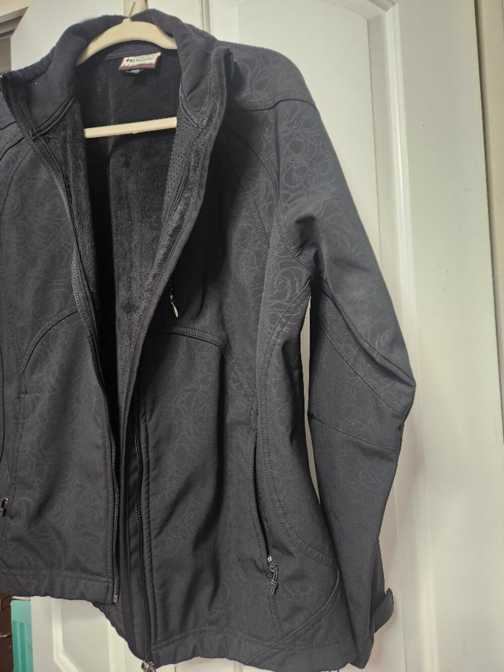 Black fleece jacket with floral pattern